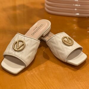 Valentino Women’s Cream Quilted Slide Sandals with Gold Emblem